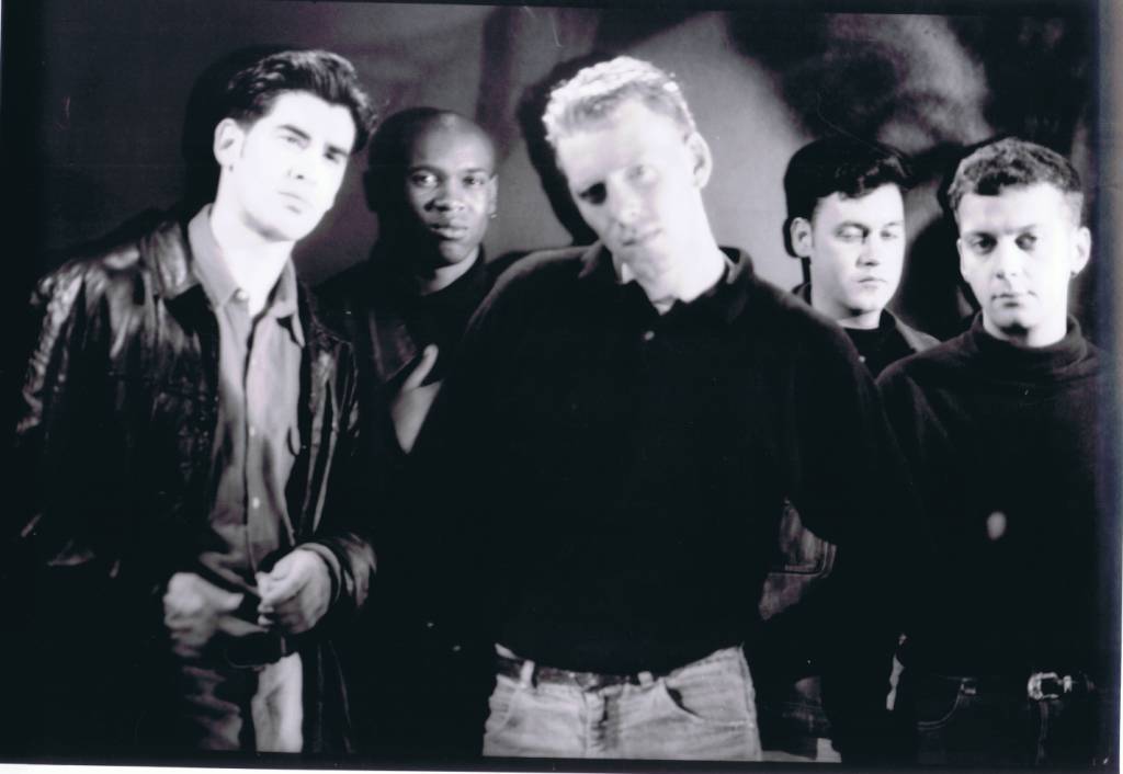 A group of people posing for a photo

Description automatically generated