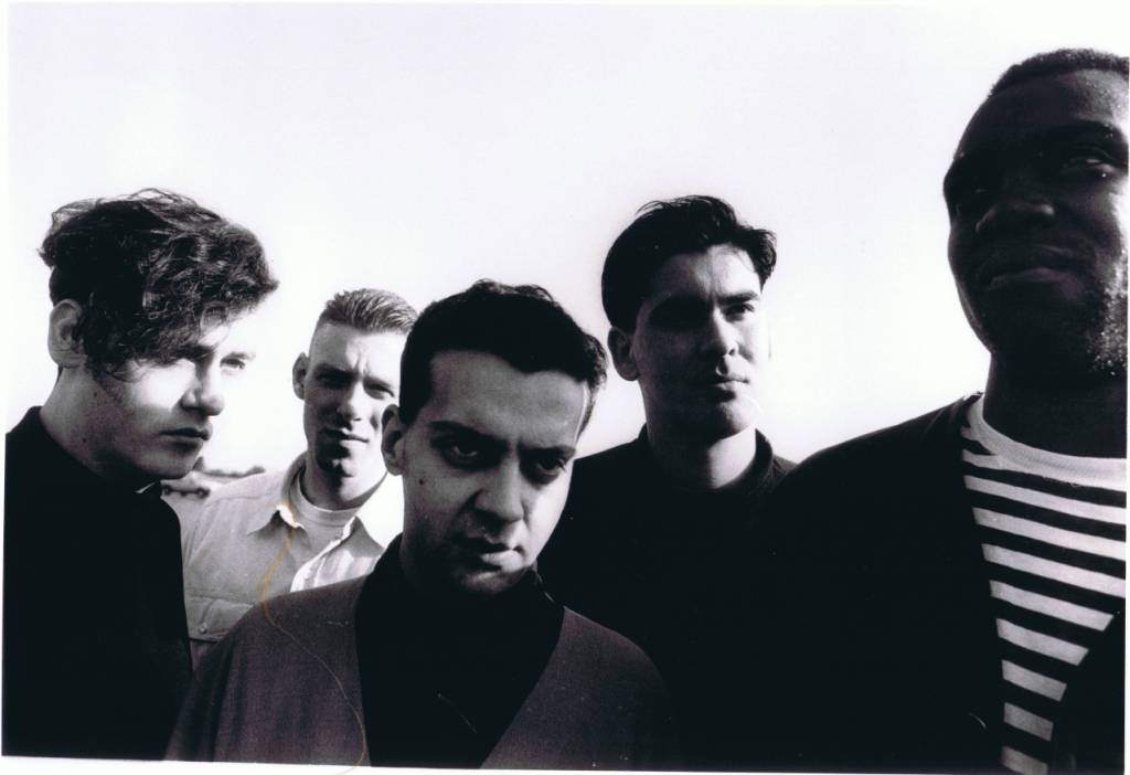 A group of people posing for the camera

Description automatically generated