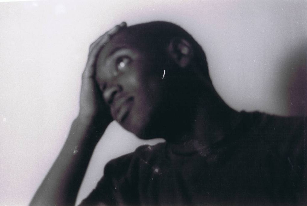 A person looking at the camera

Description automatically generated