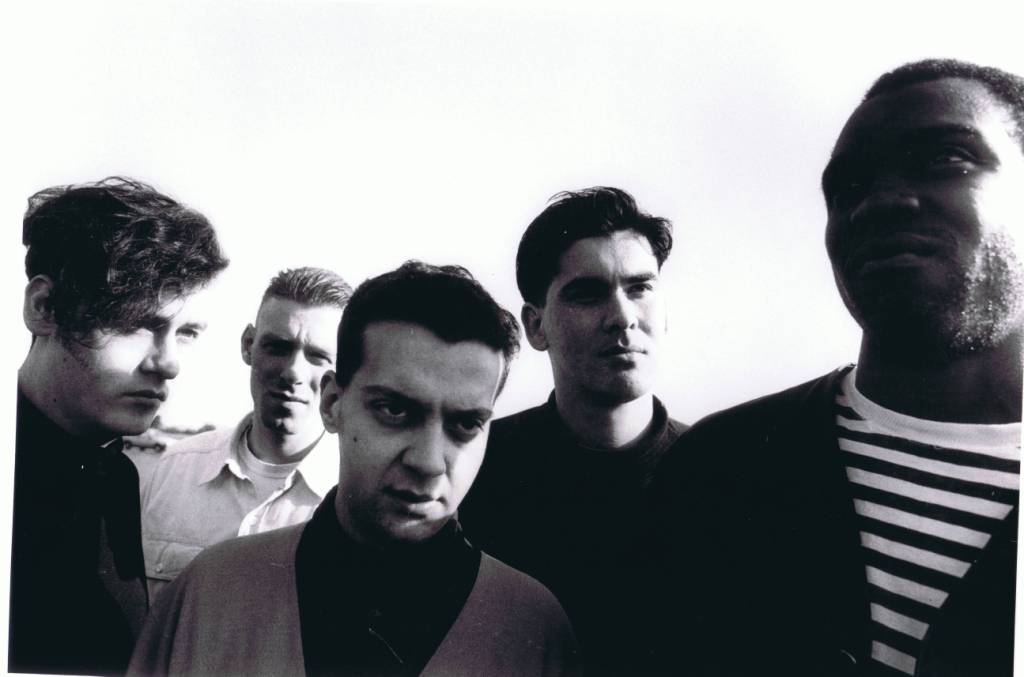 A group of people posing for the camera

Description automatically generated