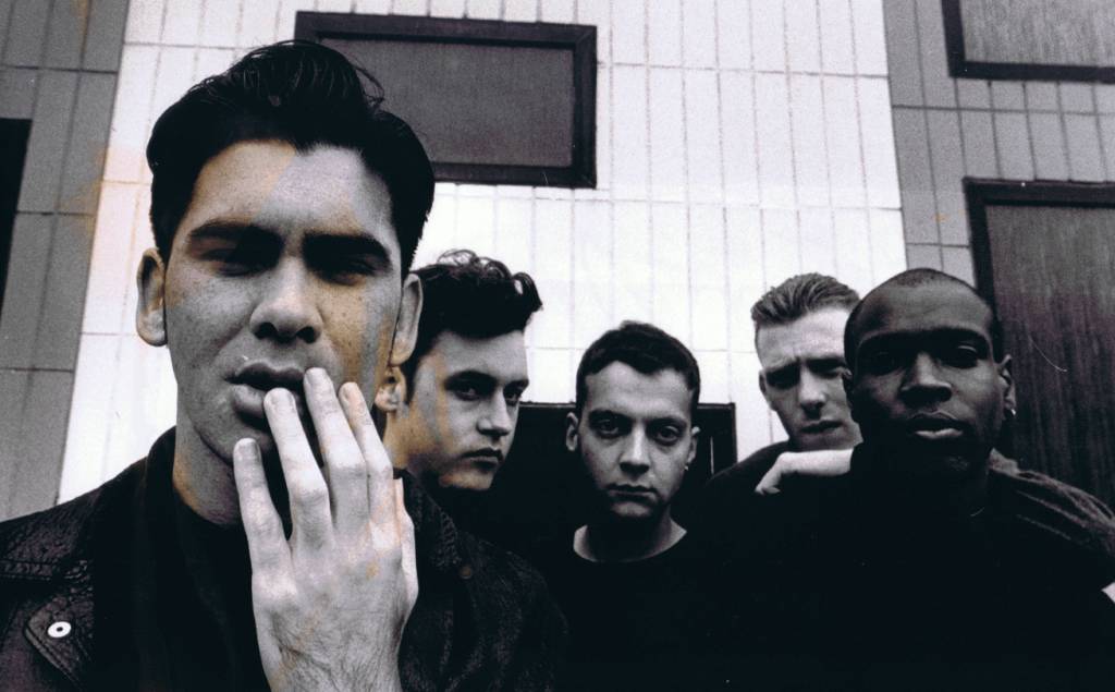 A group of people posing for the camera

Description automatically generated