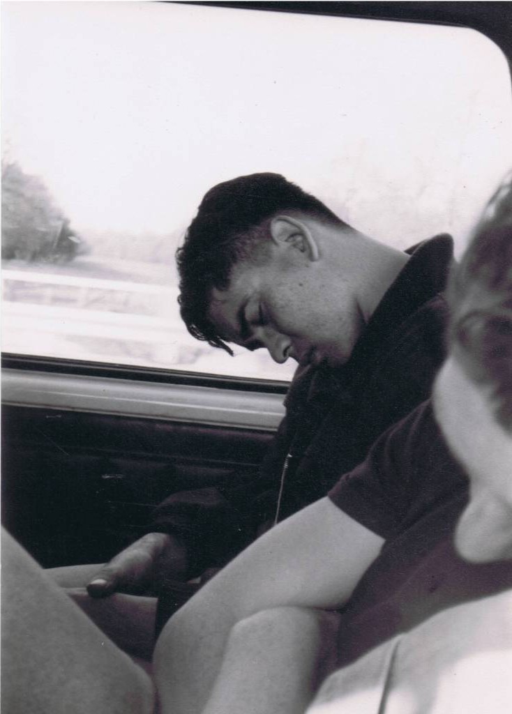 A person sitting in front of a car window

Description automatically generated