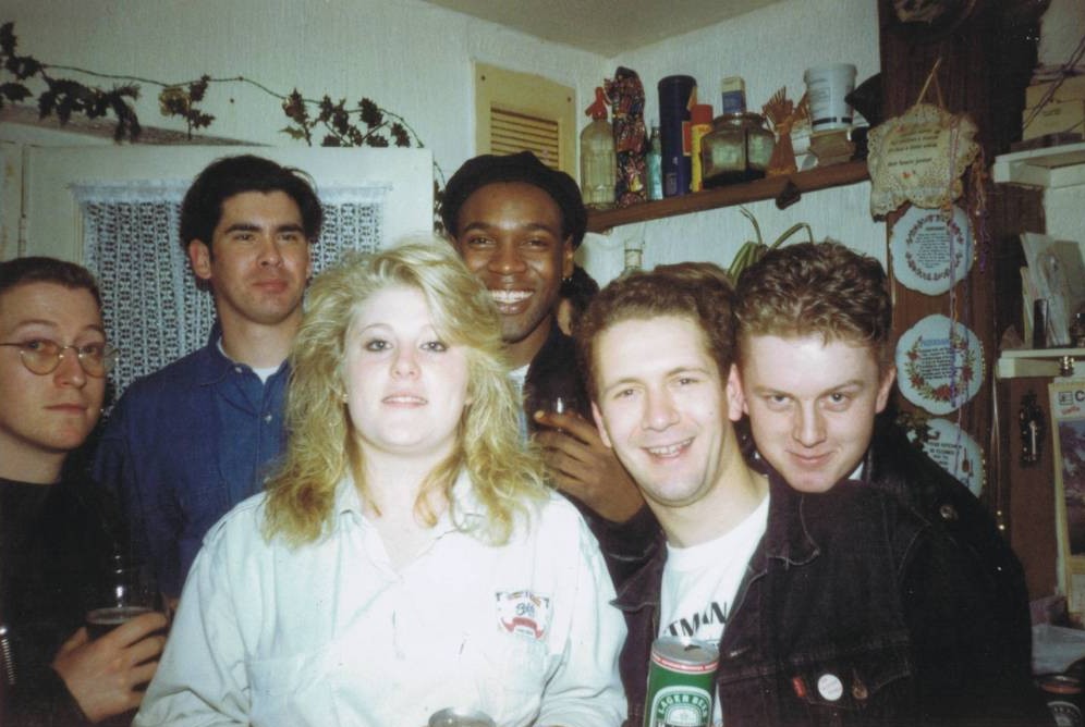 A group of people posing for the camera

Description automatically generated